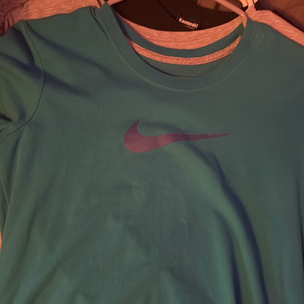 blueish green nike shirt. NEVER been worn and is a slim fit shirt